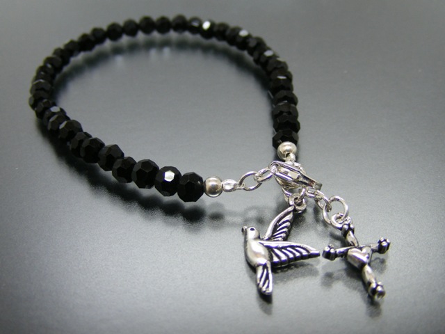 Armband mit Taube und Kreuz